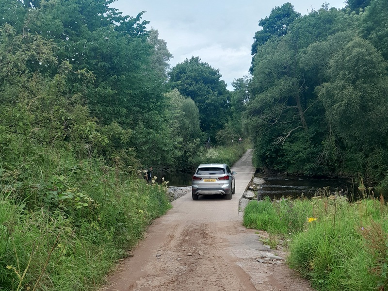 Car crossing the Ford on the Whiteadder Water at Abbey St Bathans