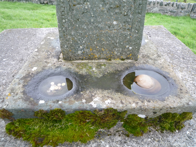 Wishing stone at base of Kilchoman Cross