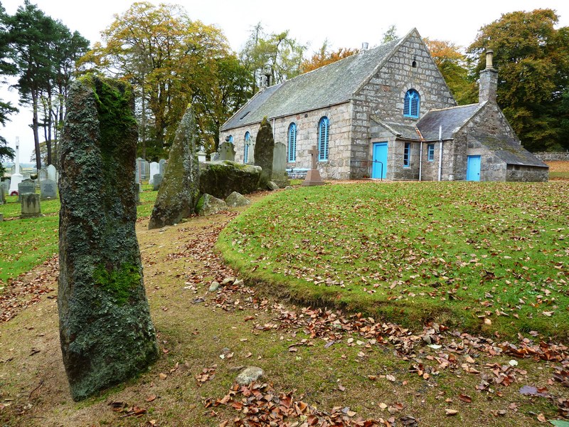 Midmar church with stone circle beside it