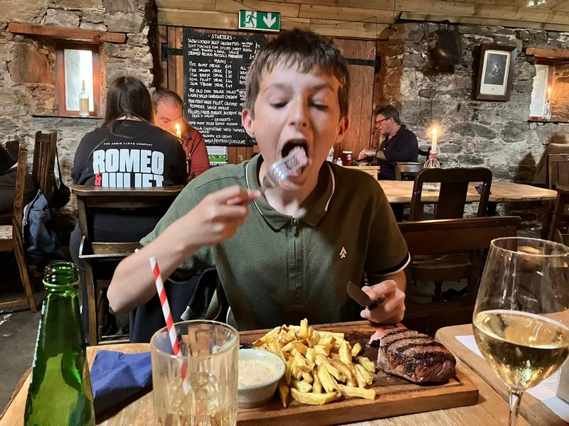 Tucking into a Steak at the Old Inn 